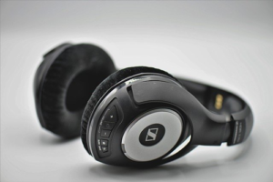 Black headphones against white backgrounds. Keep your headphones and earphones clean.