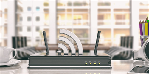 Router in an office with a Wi-Fi signal coming out. Learn how to improve your Wi-Fi and make your Internet faster.