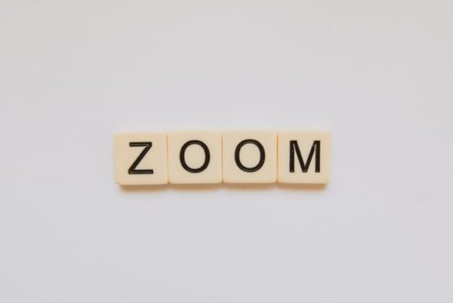 "Zoom" spelt in tiles against a white background. New features will combat disruptive participants.
