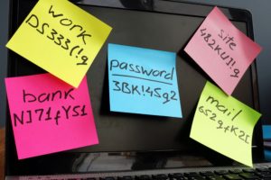 Sticky notes with passwords on a monitor. Use a password manager and ditch the paper.