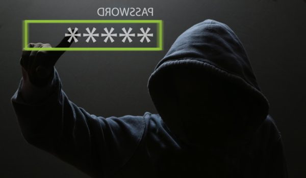 Hacker types in stolen password.