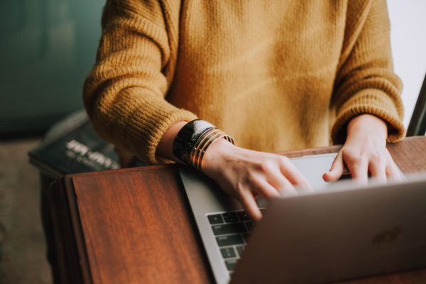 Woman using email on laptop