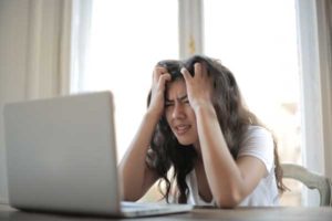 Woman stressed out by computer problems